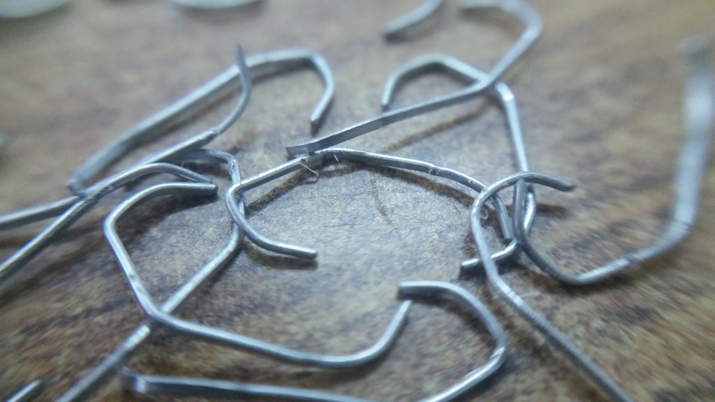 Twisted detached staples.